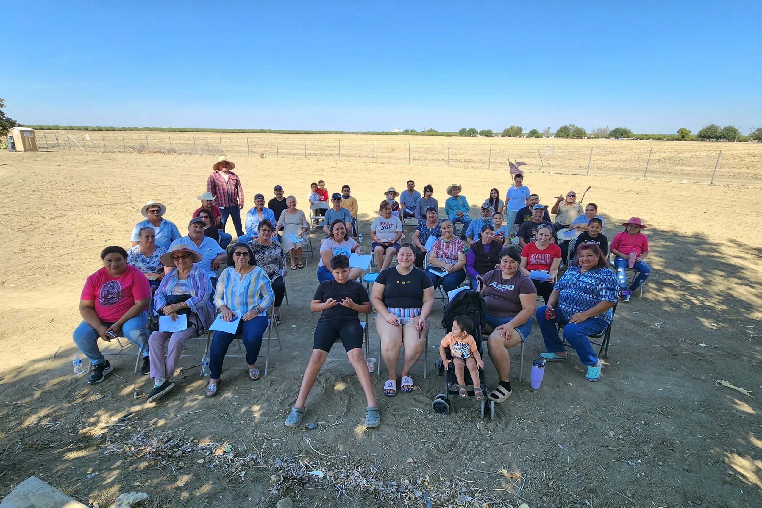Community members gathered at the Jardin Comunitario de Cantua Creek community garden
